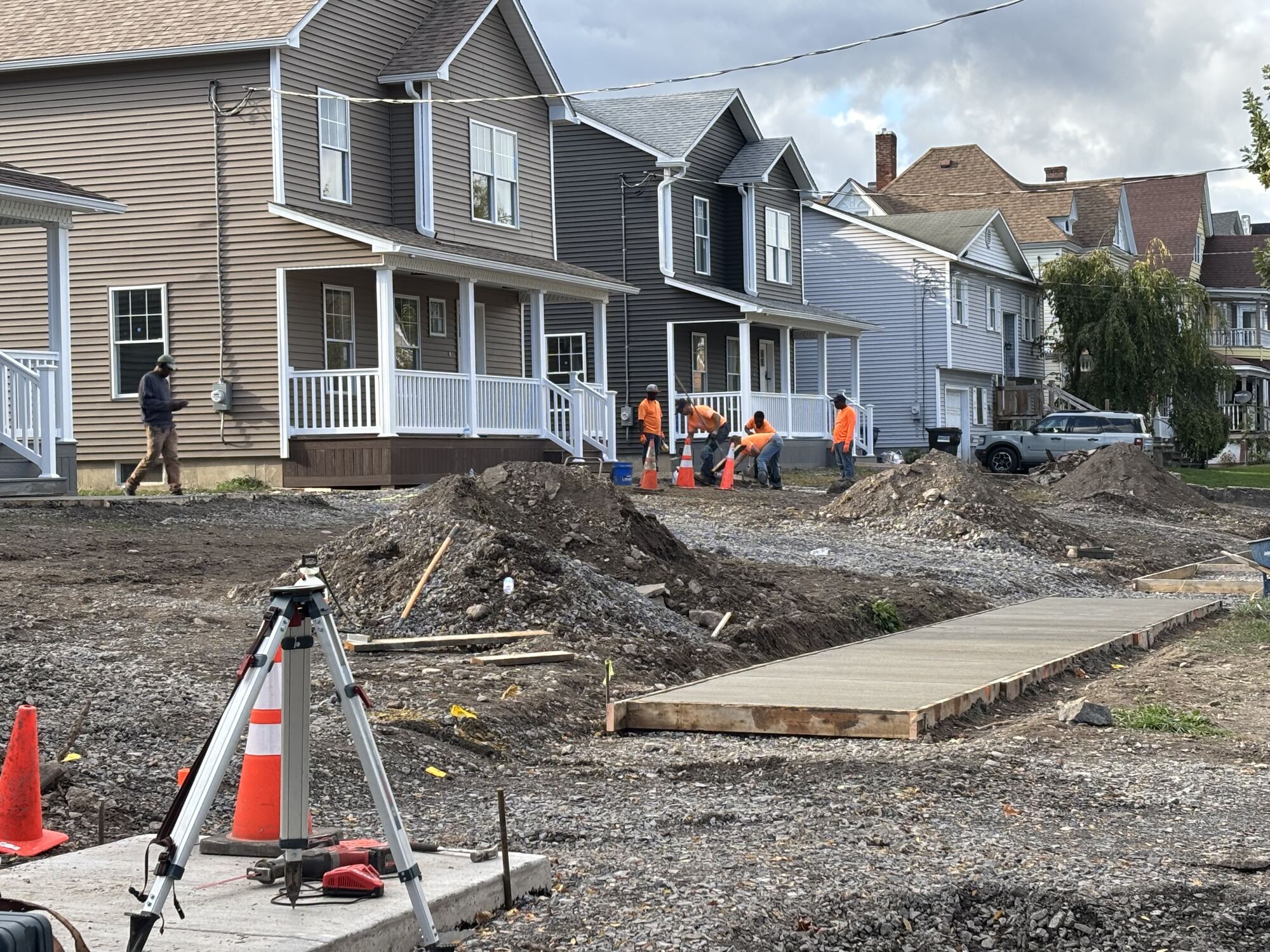 Survey equipment set up on a street ahead of construction on a VALOR project