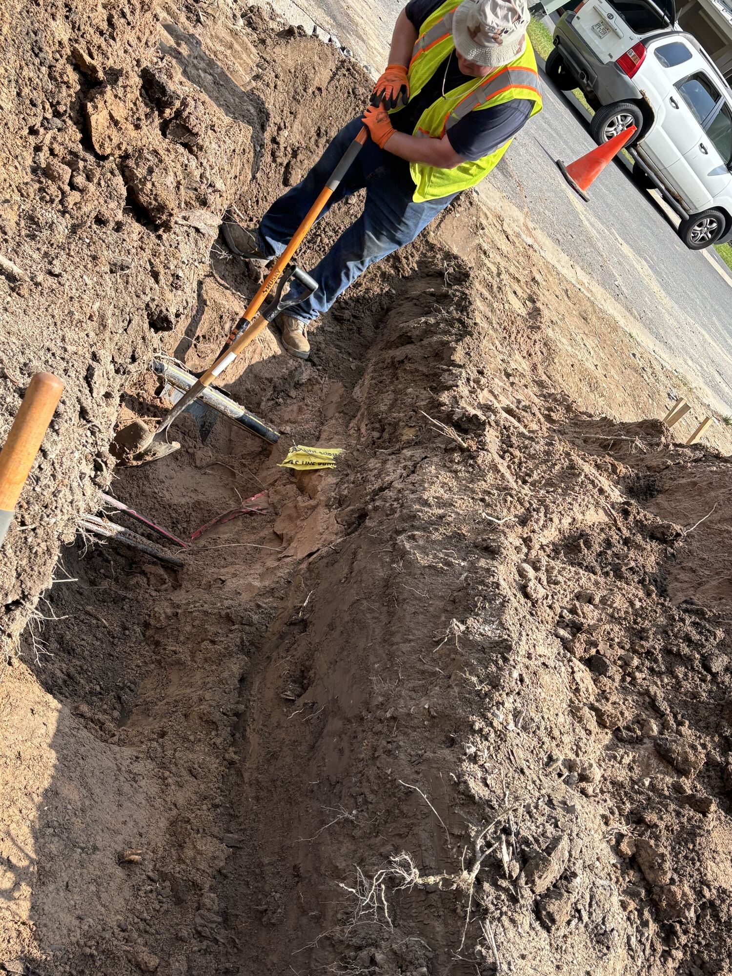 VALOR worker in an open utility trench on a Syracuse job site